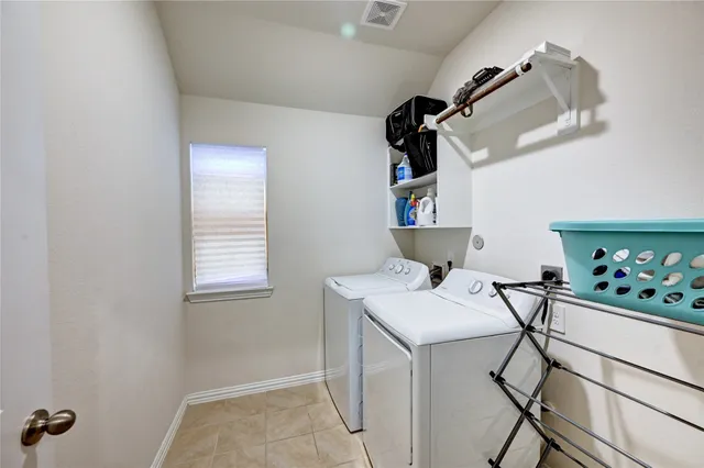 a kitchen that has a sink and a refrigerator