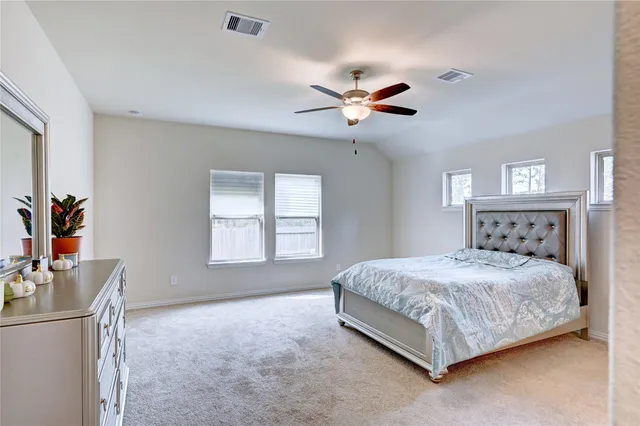 a view of a backyard with a tub and wooden fence