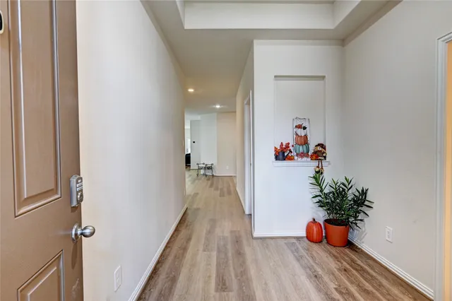 a white toilet sitting next to a bathroom sink and vanity