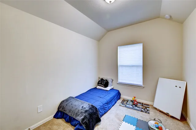 a bedroom with a bed and walk in closet