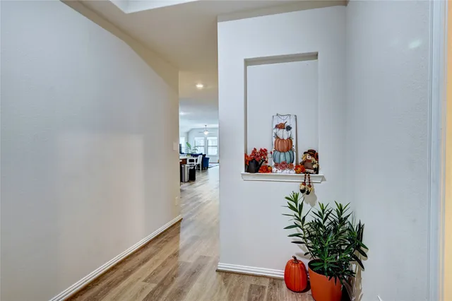 a kitchen with sink cabinets and wooden floor