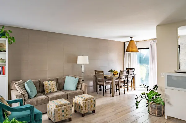 a living room with furniture and wooden floor