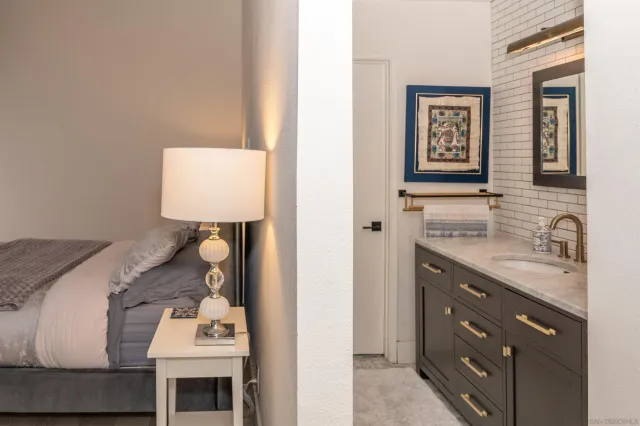 a bathroom with a sink toilet and mirror