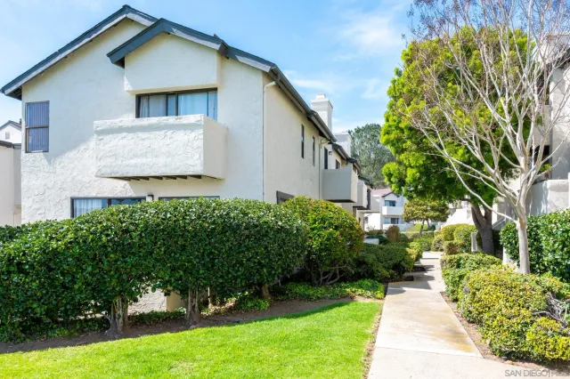 a view of a patio with a table chairs and a table