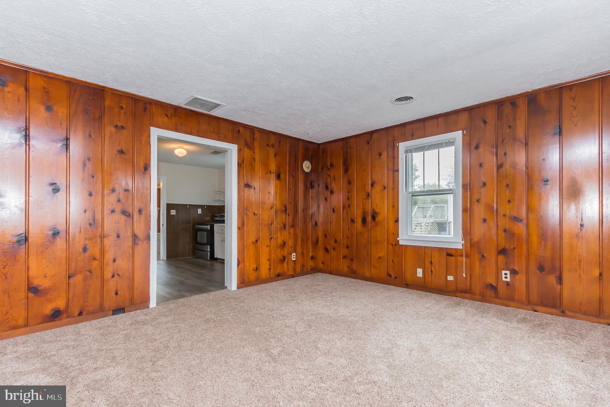 20625 Whites Ferry Road Poolesville, MD 20837 - Photo 23 of 38 20629 Living room leading to kitchen