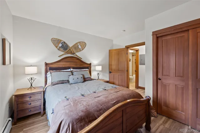 a bathroom with a toilet a sink and shower