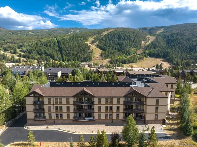a view of a chairs and table in patio