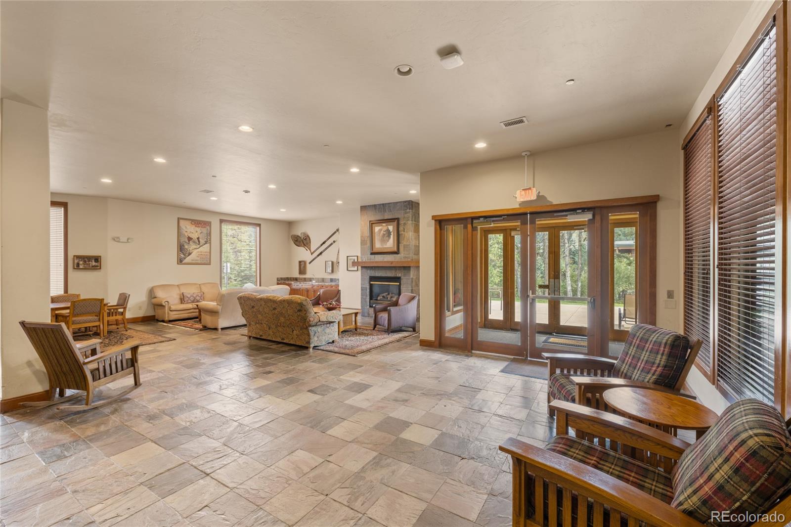 22787 Highway 6, Unit 209 Dillon, CO 80435 - Photo 32 of 49 a living room with furniture a flat screen tv and large windows