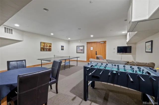 a kitchen with stainless steel appliances granite countertop a stove microwave and refrigerator