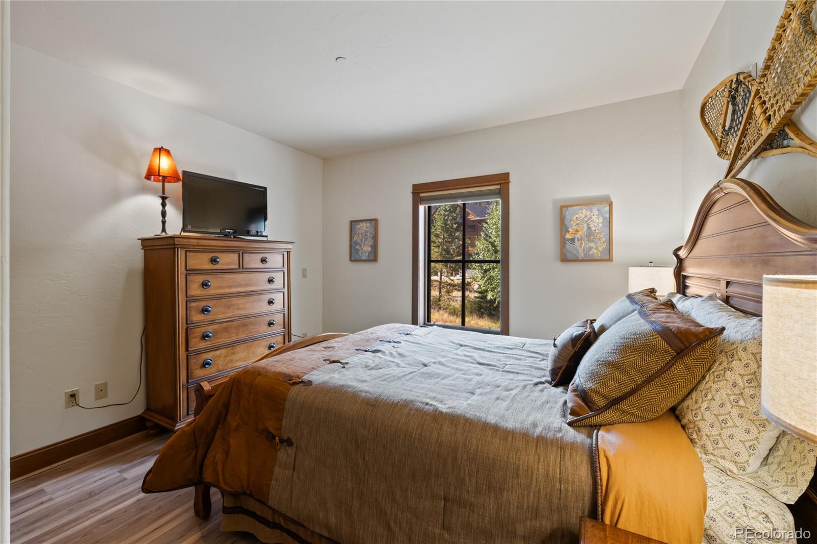 22787 Highway 6, Unit 209 Dillon, CO 80435 - Photo 48 of 49 a bedroom with a bed and a flat screen tv