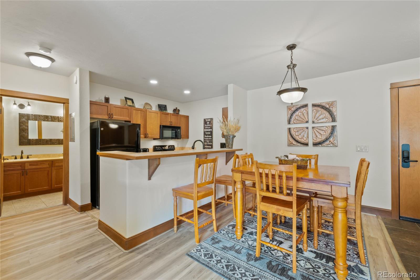 22787 Highway 6, Unit 209 Dillon, CO 80435 - Photo 6 of 49 a view of a dining room with furniture window and wooden floor