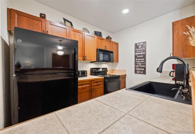 a kitchen with a stove and a sink