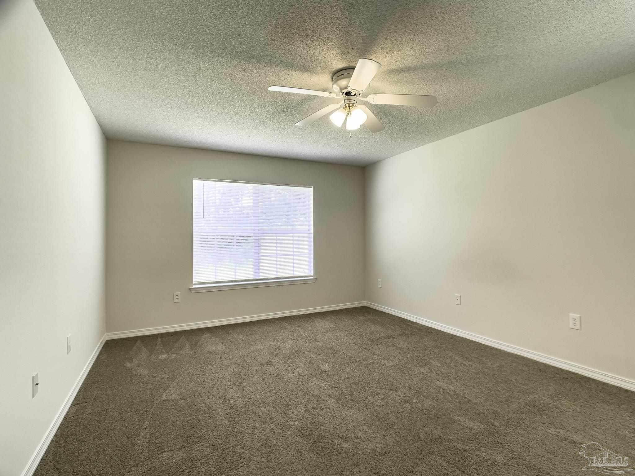 1267 Sterling Point Place Gulf Breeze, FL 32563 - Photo 13 of 27 an empty room with a window and a fan