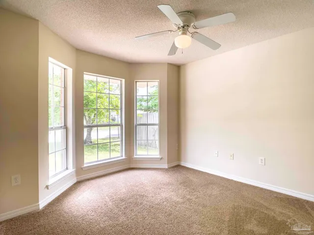 an empty room with closet area