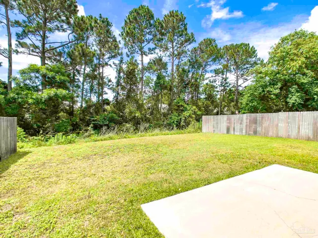a house with swimming pool in front of it