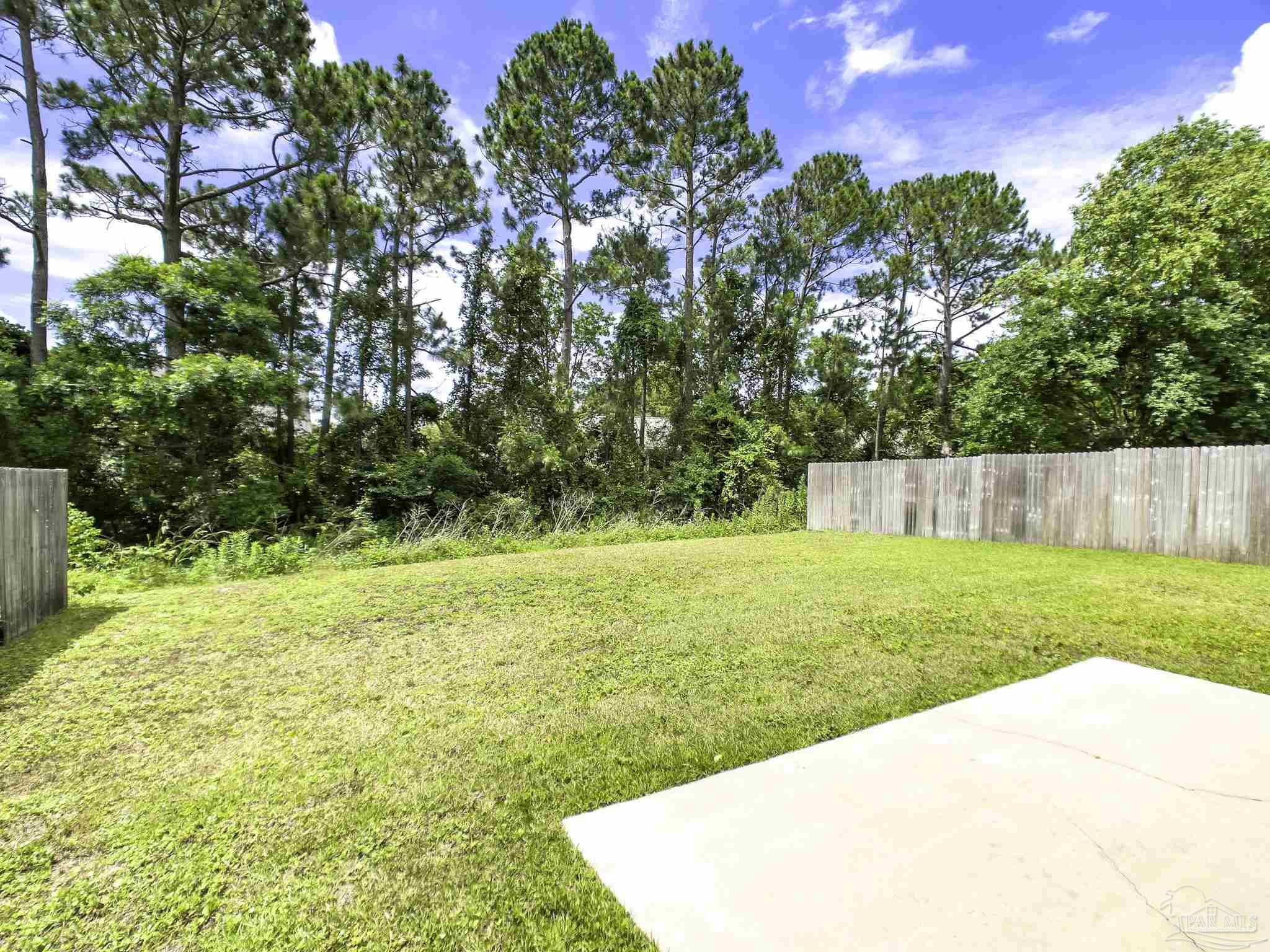 1267 Sterling Point Place Gulf Breeze, FL 32563 - Photo 26 of 27 a view of a swimming pool with an outdoor space and seating area