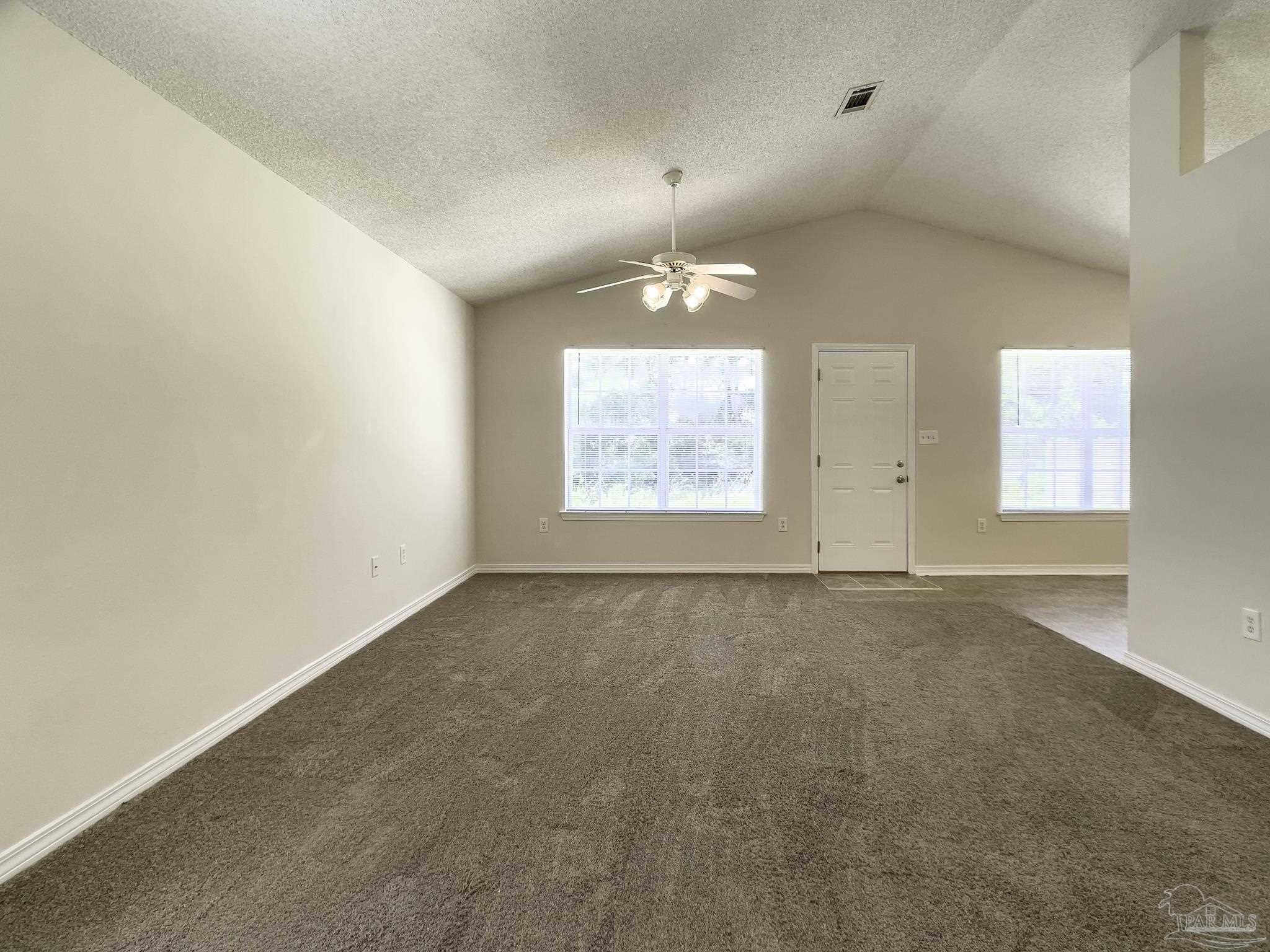 1267 Sterling Point Place Gulf Breeze, FL 32563 - Photo 5 of 27 an empty room with windows and painted walls