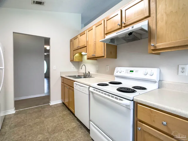a kitchen that has a stove and a microwave