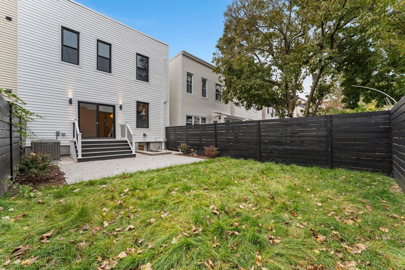 83 Liberty Place, Unit 1 Weehawken, NJ 07086 - Photo 14 of 39 a view of backyard with wooden fence