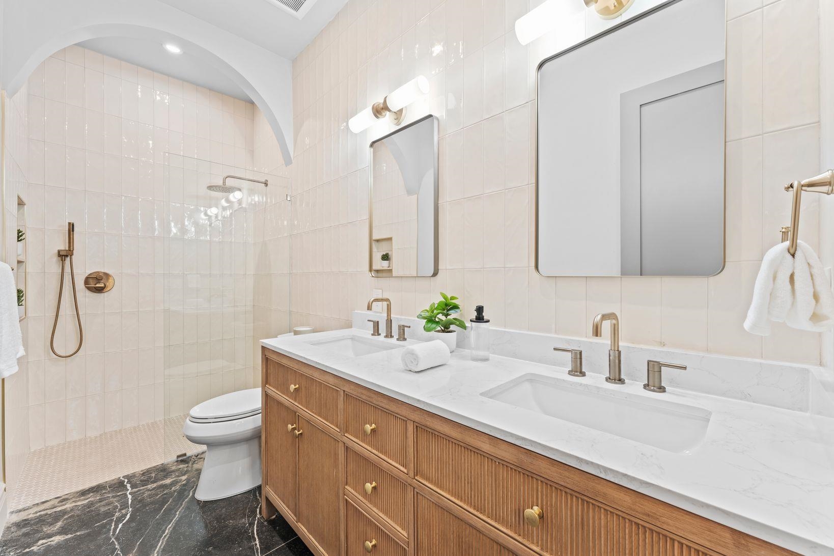 83 Liberty Place, Unit 1 Weehawken, NJ 07086 - Photo 20 of 39 a bathroom with a sink a toilet and shower