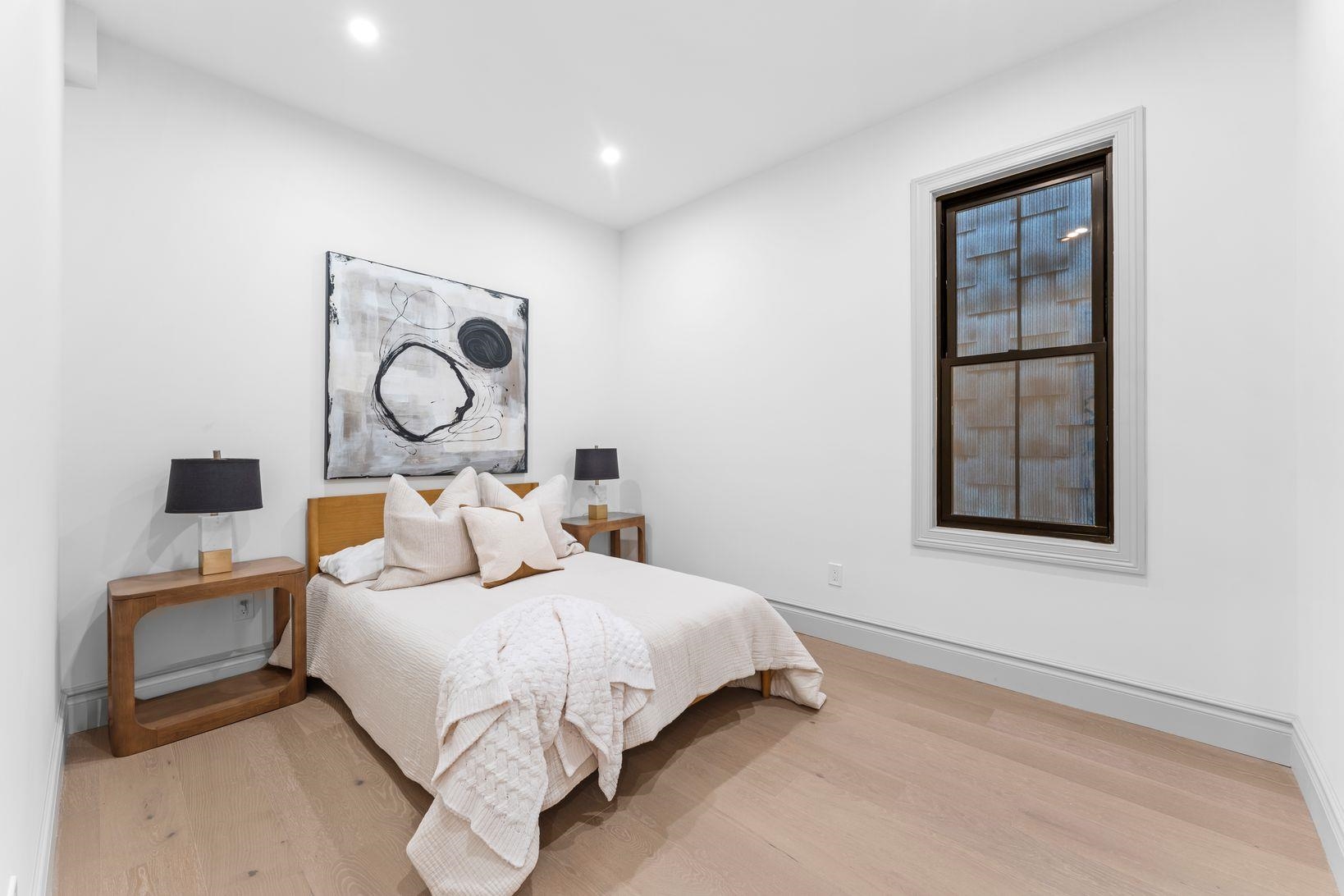 83 Liberty Place, Unit 1 Weehawken, NJ 07086 - Photo 21 of 39 a bedroom with a bed and window