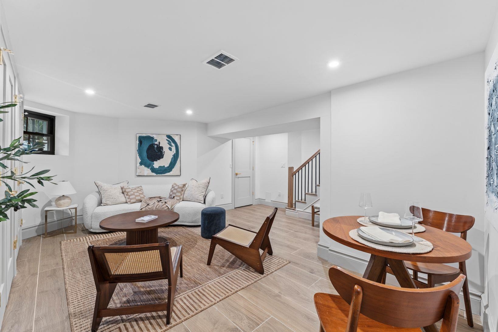 83 Liberty Place, Unit 1 Weehawken, NJ 07086 - Photo 26 of 39 a living room with furniture and a wooden floor