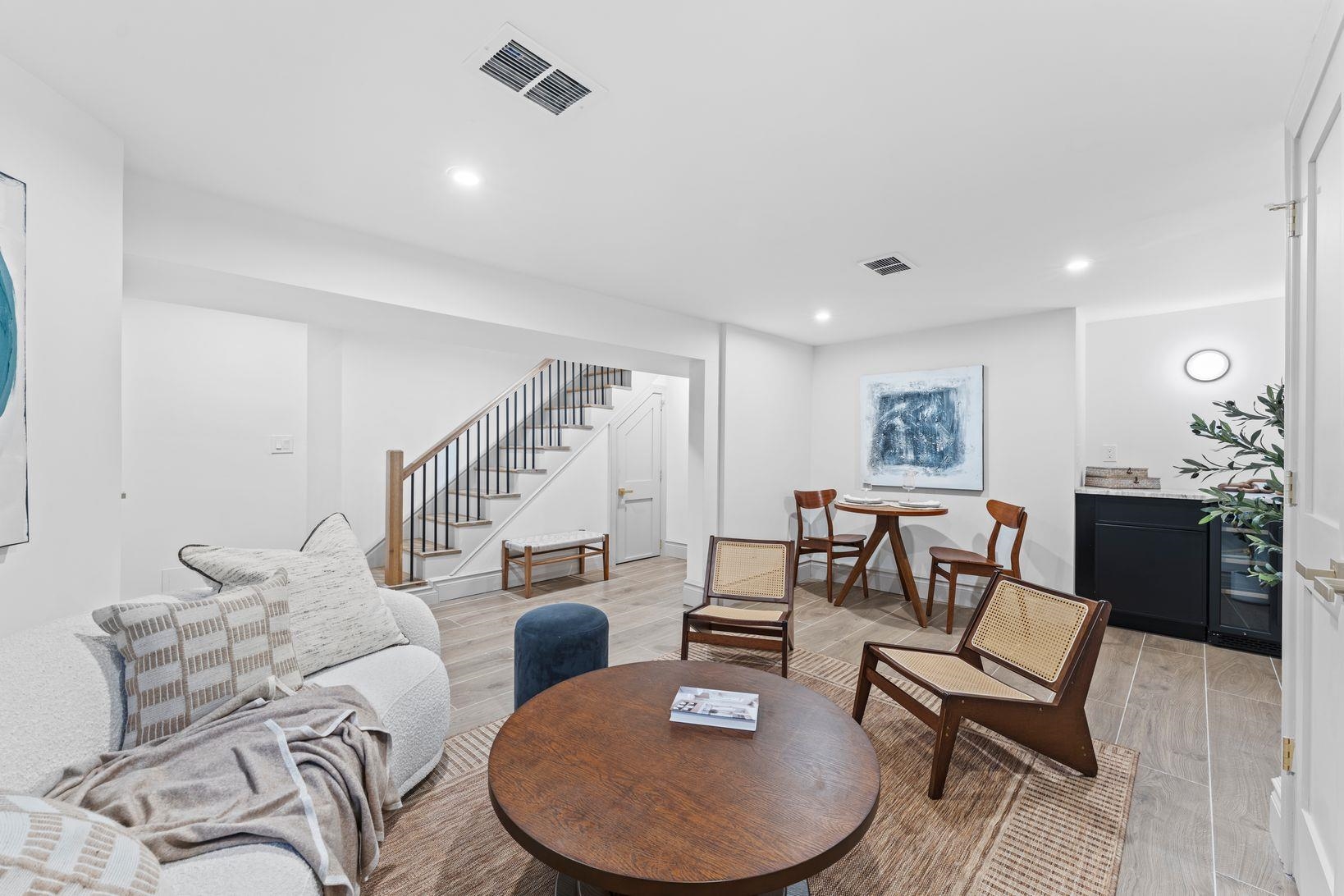83 Liberty Place, Unit 1 Weehawken, NJ 07086 - Photo 27 of 39 a living room with furniture and wooden floor