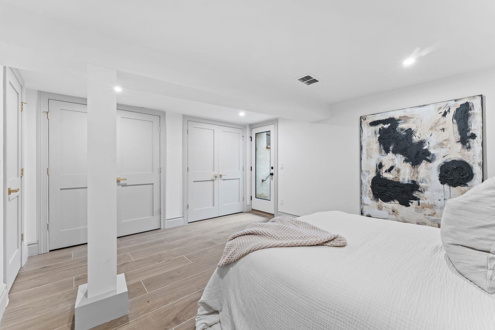 83 Liberty Place, Unit 1 Weehawken, NJ 07086 - Photo 31 of 39 a bedroom with a bed and a window