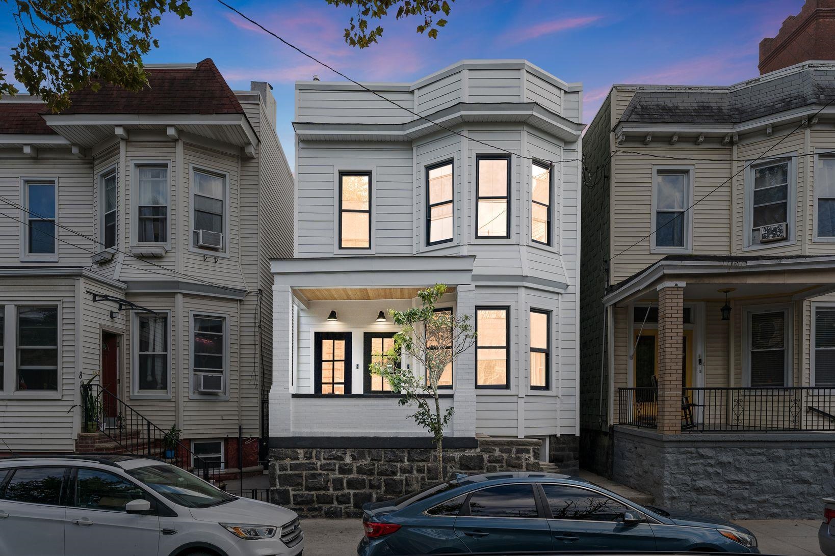 83 Liberty Place, Unit 1 Weehawken, NJ 07086 - Photo 33 of 39 a front view of a house with car parked