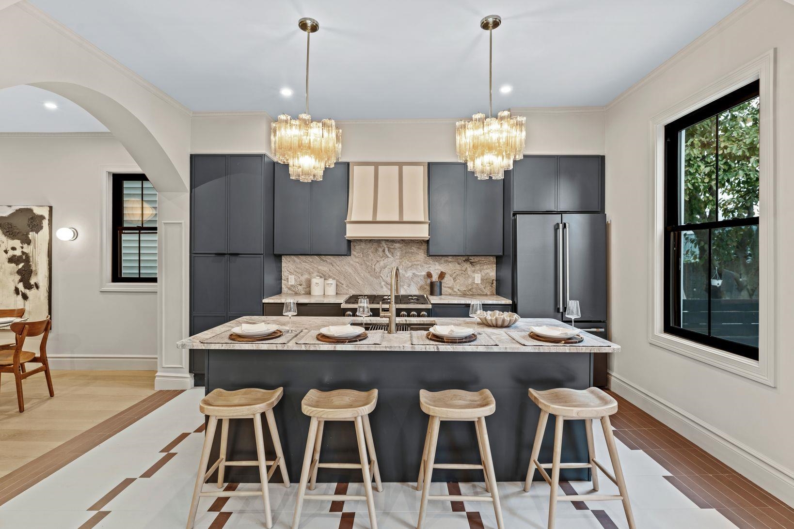 83 Liberty Place, Unit 1 Weehawken, NJ 07086 - Photo 5 of 39 a view of a dining room with furniture a chandelier and wooden floor