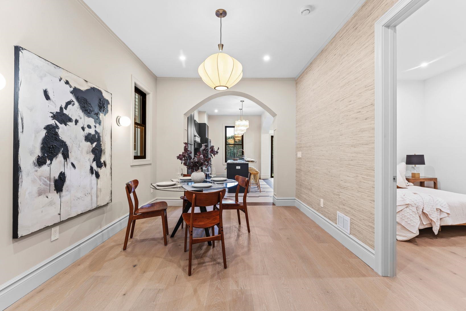 83 Liberty Place, Unit 1 Weehawken, NJ 07086 - Photo 10 of 39 a view of a dining room with furniture and chandelier