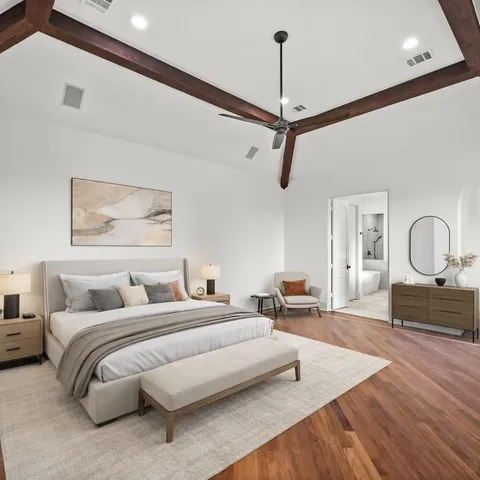 a large white bed in a white room