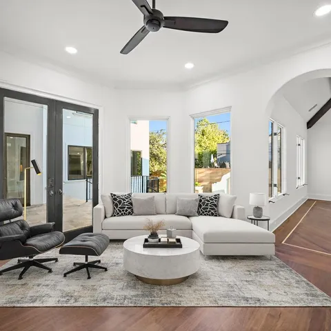 a bathroom with a granite countertop sink a mirror and a shower