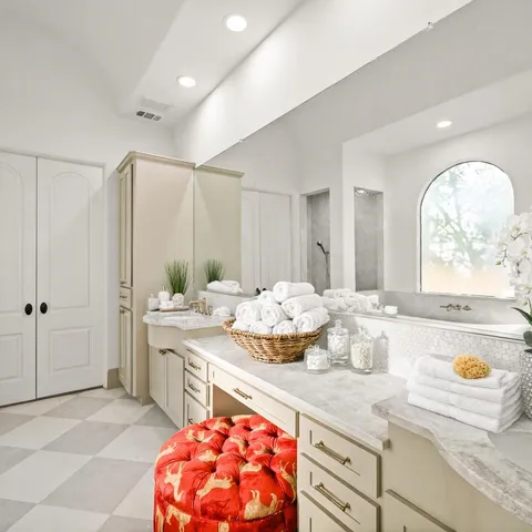 a bathroom with a bathtub and a shower