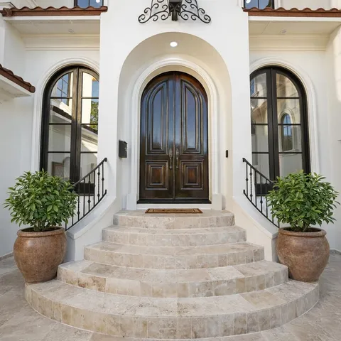 a living room with furniture flowerpot and a fireplace