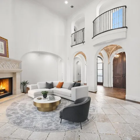 a kitchen with granite countertop white cabinets and stainless steel appliances
