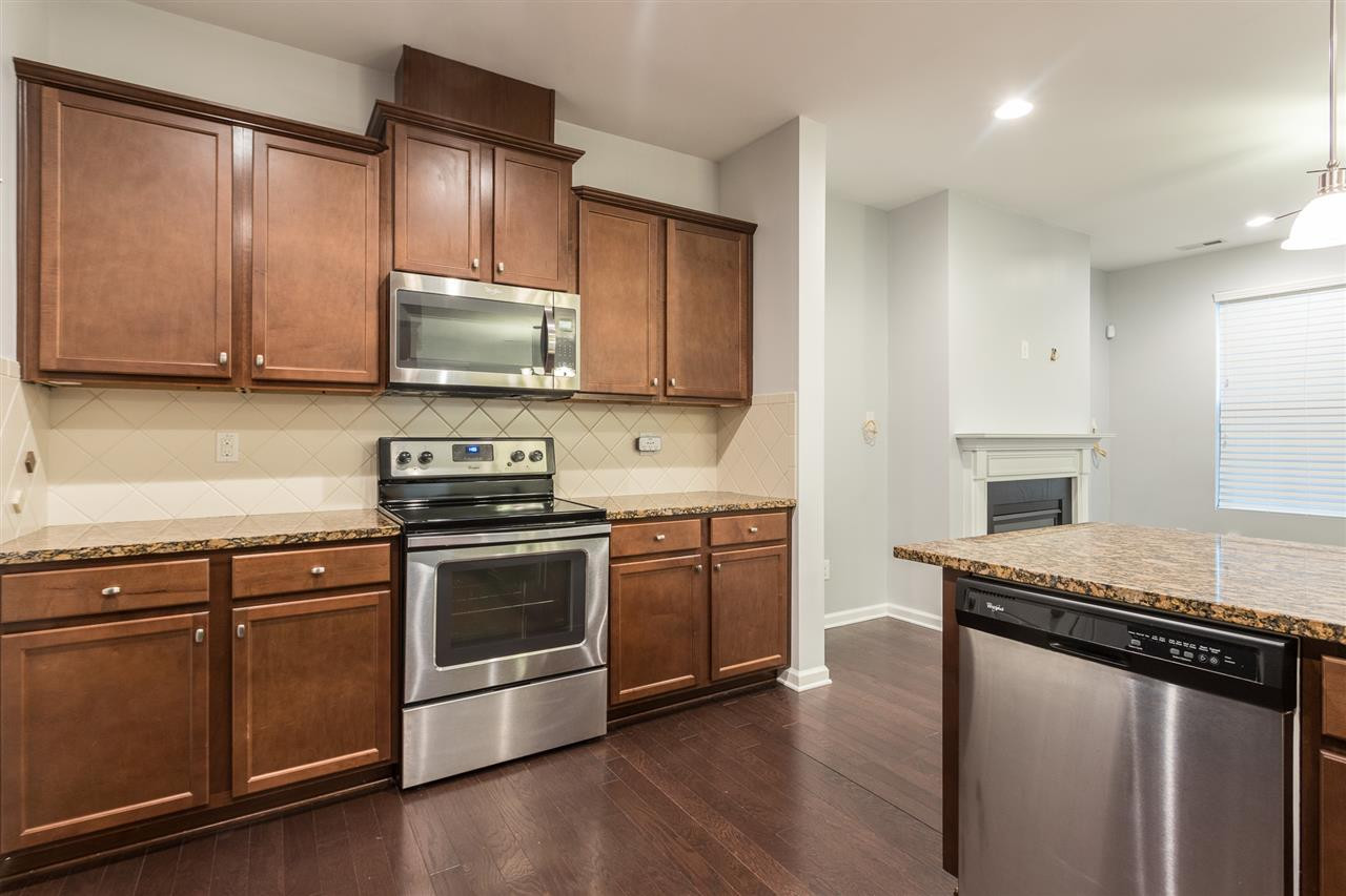 9929 Lynnberry Place Raleigh, NC 27617 - Photo 16 of 30 Note the beauty of this lovely and spacious kitchen which is graced with beautiful cabinetry and stunning granite counter tops. Kitchen