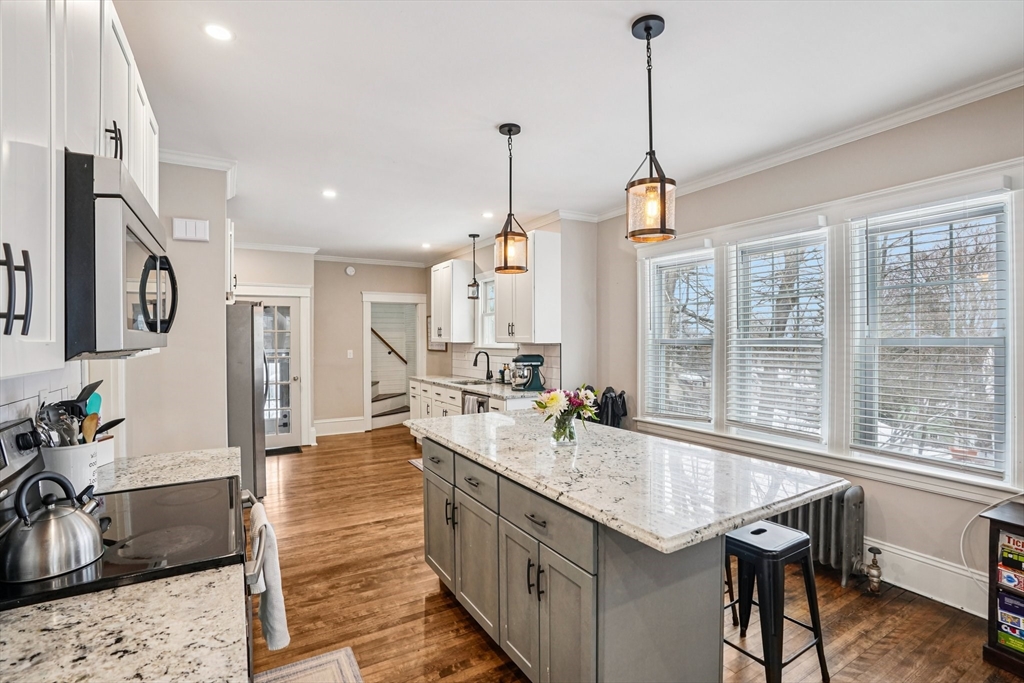 14 Balder Road Worcester, MA 01605 - Photo 15 of 34 a kitchen with granite countertop a sink a counter top space and living room view