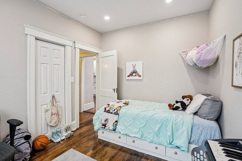 14 Balder Road Worcester, MA 01605 - Photo 18 of 34 a bedroom with a bed and wooden floor
