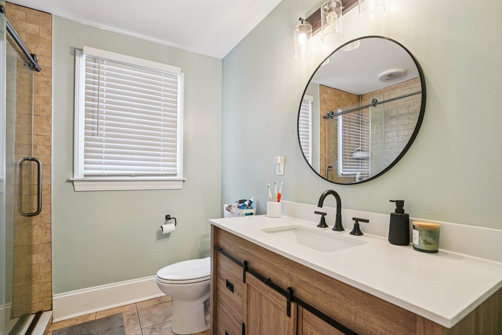 14 Balder Road Worcester, MA 01605 - Photo 19 of 34 a bathroom with a sink a toilet and a mirror