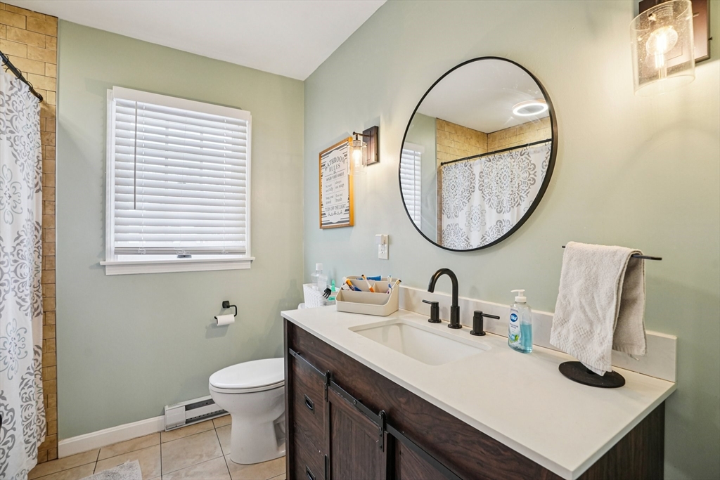 14 Balder Road Worcester, MA 01605 - Photo 26 of 34 a bathroom with a sink and a mirror