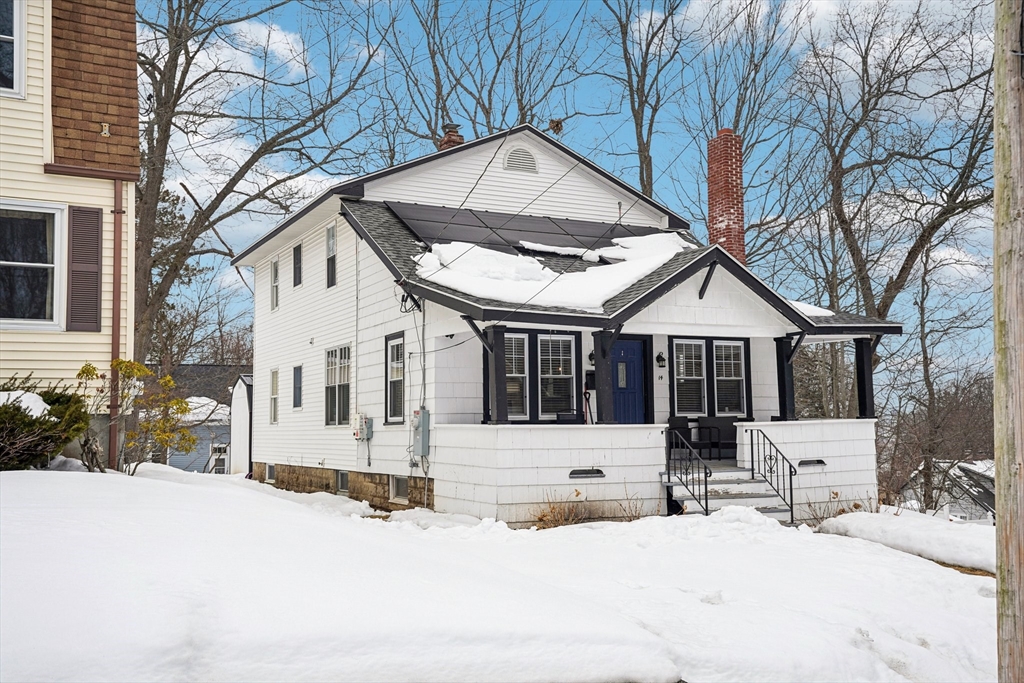 14 Balder Road Worcester, MA 01605 - Photo 4 of 34 a view of a white house with a yard and covered trees