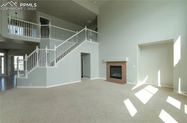 a view of livingroom and kitchen with furniture