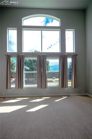 a view of a room that has a bed