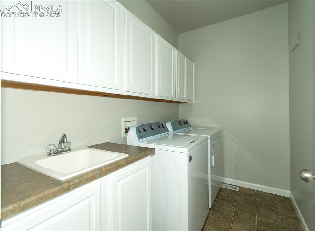 9443 St.George Road Peyton, CO 80831 - Photo 22 of 45 a utility room with dryer and washer