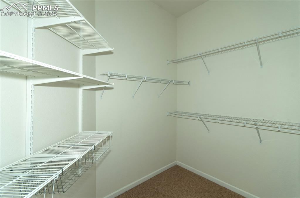 9443 St.George Road Peyton, CO 80831 - Photo 28 of 45 a view of a room with racks on the wall
