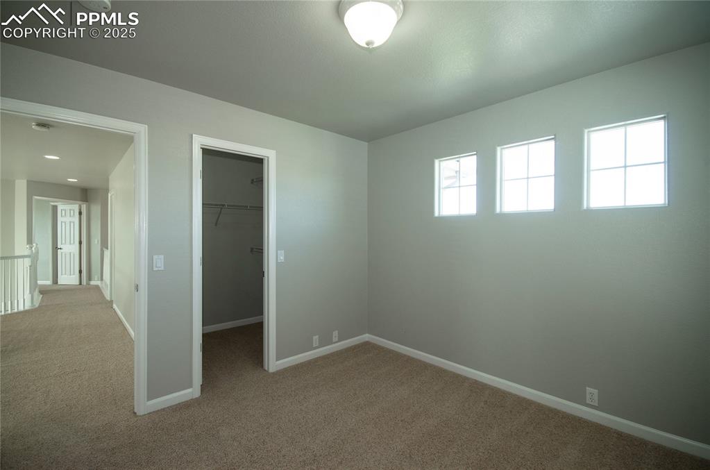 9443 St.George Road Peyton, CO 80831 - Photo 30 of 45 an empty room with windows and closet