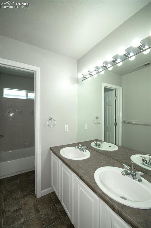 9443 St.George Road Peyton, CO 80831 - Photo 32 of 45 a bathroom with a sink and a mirror