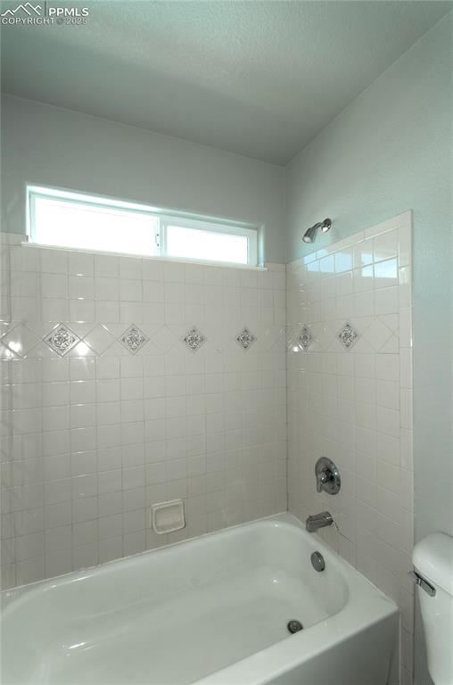 9443 St.George Road Peyton, CO 80831 - Photo 33 of 45 a bathroom with a bathtub and shower