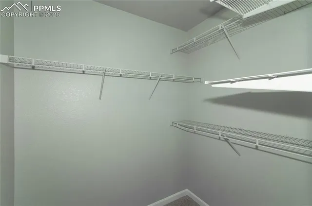 a view of a room with racks on the wall